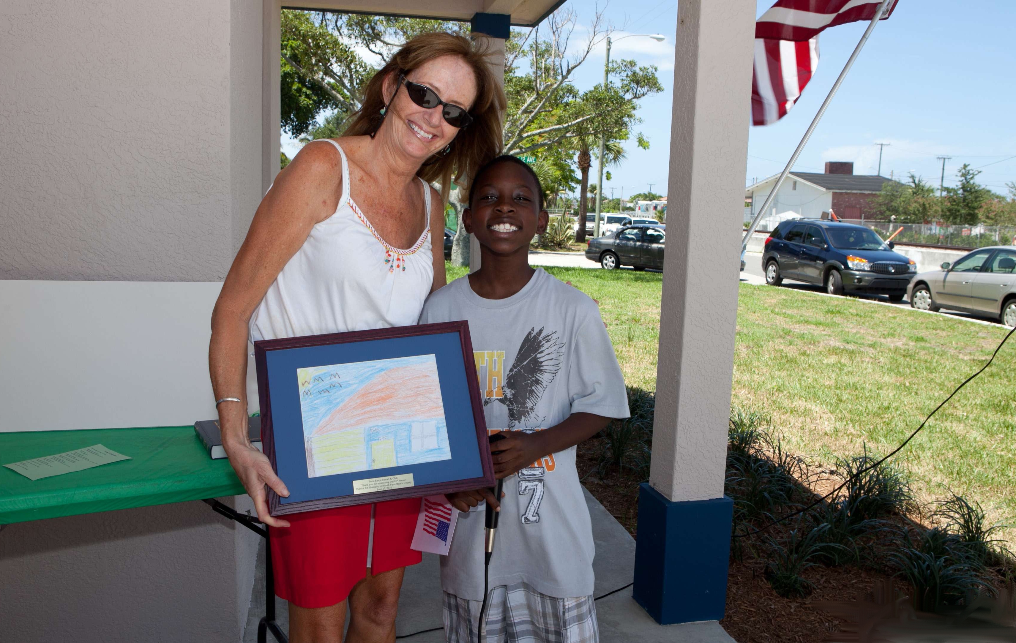 Sandra Tagliavia of Boca Raton Resort & Club, with Lacrecia Bevin ’s son, Jubari.