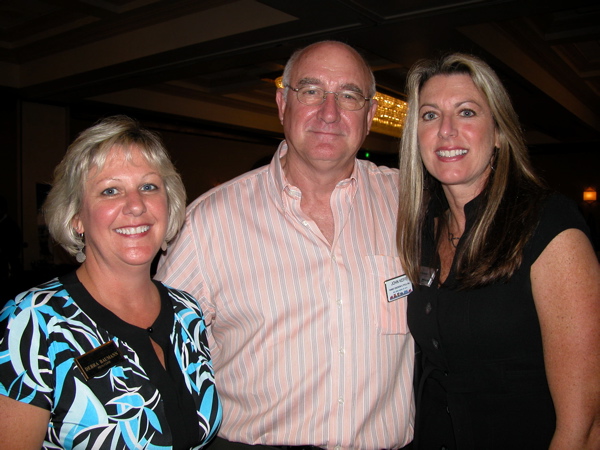 Debra Baumann, a Realtor with Florida WCI Realty, left, with ; John Keife of Family Escrow & Title Inc. and Kris Escheete of National City Mortgage in West Palm Beach.