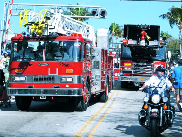 Fire trucks from Palm Beach County and Coral Springs make their way down Atlantic Ave.