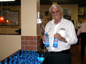 ray fassberg holding bottles of Brooklyn Water Bagel Co. water.