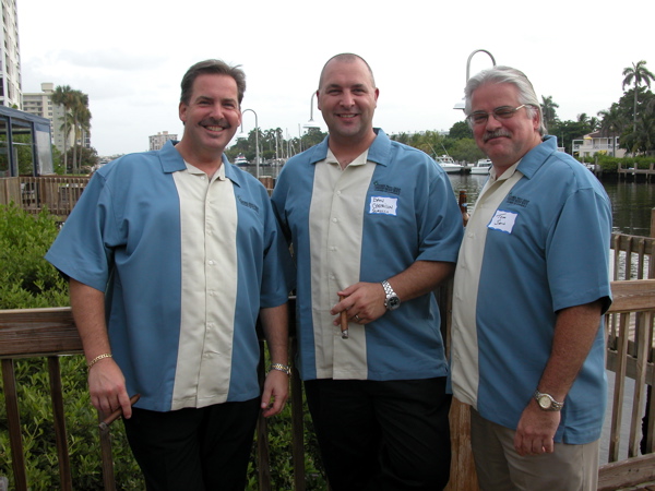 The chamber men's group brain trust enjoying a smoke courtesy of Cigar Conneseur: Former head Tom Kriete of ComputerWorx, left, with Daniel Castrillon of the Scirocco Group; and Tom Serio of Verizon Wireless. 