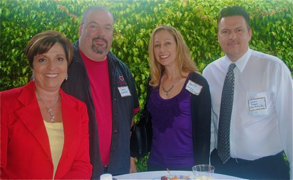 Delray Beach Chamber Executive VP Beth Johnston, left, with David Schmidt and Becky J. Remmel, both of Evolution Entertainment, and Dennis R. Farrar of the New York Life Insurance Co.