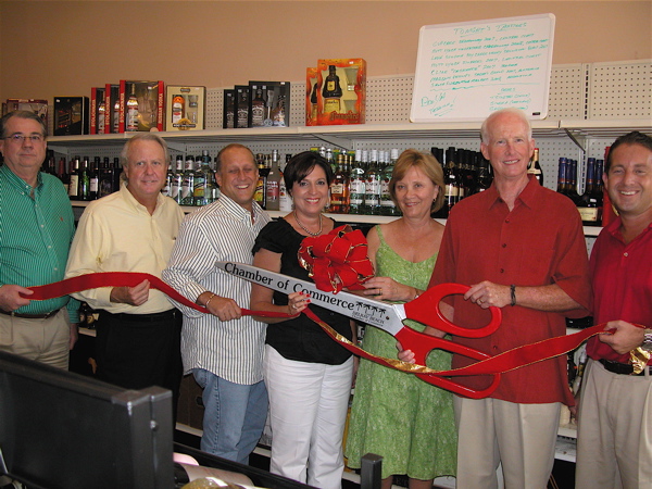 From left, Delray Beach Mayor Woodie McDuffie, Commissioners Fred Fetzer and Gary Eliopoulos, Beth Johnston, executive vice president with the Delray Beach Chamber of Commerce, Sue and Dave Spitzer, owners of Old Vines, and Commissioner Adam Frankel.