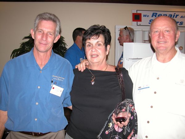 Ken Griffiths of Shutter Services & Screen Repairs, left, with Cary and William McColman, independent distributors of Premium Acai Blend. 