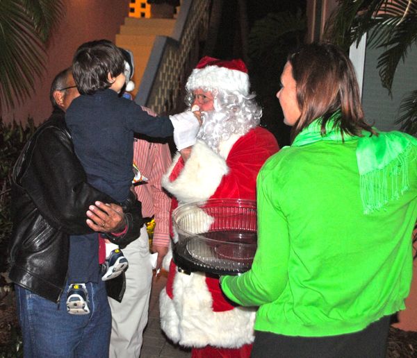 Yes the beard's real, Santa seems to be telling this young chamber member!