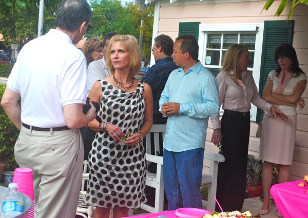 kelly collins mingles among her guests.