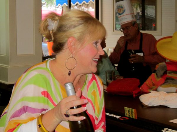 Nancy Dockerty, a library board member, tends bar.