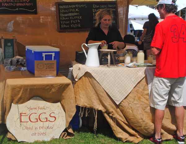 Svetlana Simon of Heritage Hen Farm in Boynton Beach takes care of a customer. Heritage not only sells hens eggs but raw dairy products as well.