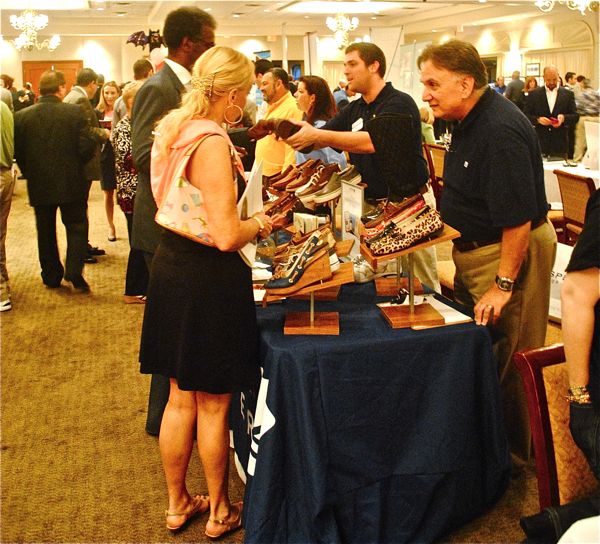 Chamber members examine some of the wares on display at the mini-expo. 