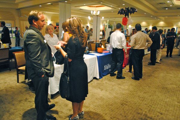 Making connections at the South County Business Card Exchange. 