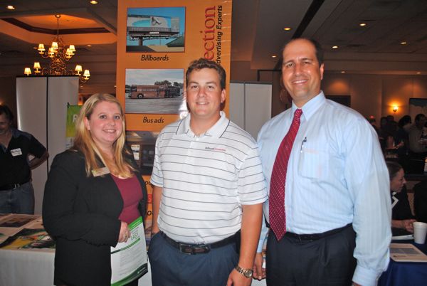 Mac Ross of Billboard Connection, center, is flanked by Kaitlyn Burke and Joe Scondotto, both of TD Bank offices in Boca Raton. 