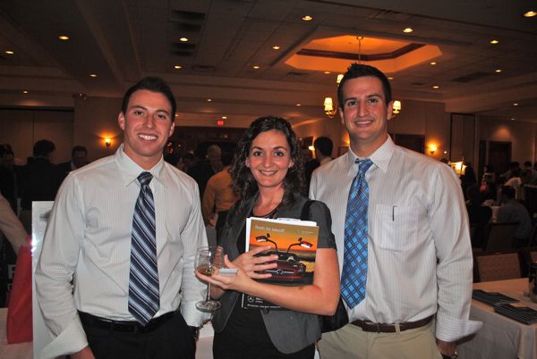 Scott Filhaber and Jordan Gluck of the Dataman Group flank Angela Gasperson Amplify Virtual Assistant Services. 