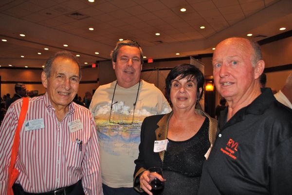 Edgar L. Lewis, a manufacturing and distributor representative, left, with Michael McKnight of McJimz Auto, Cary McColman and William McColman of Mona Via. 