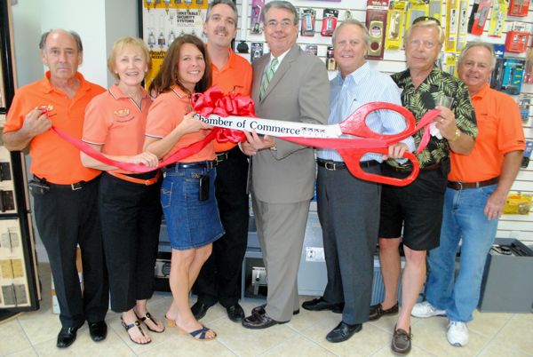 From left, owners Chris and Bruce Volpe and Robert and Tina Stephens, with Mayor Woodie McDuffie, City Commissioner Fred Fetzer, Drew Barta of the Delray Beach Chamber and manager John. 