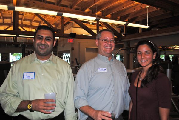 Moe Malmuwata if Fast Teks Computer Services, left, with Steve Shelby of FarVision Networks and Samantha Inguannzo of Ocean Optics.