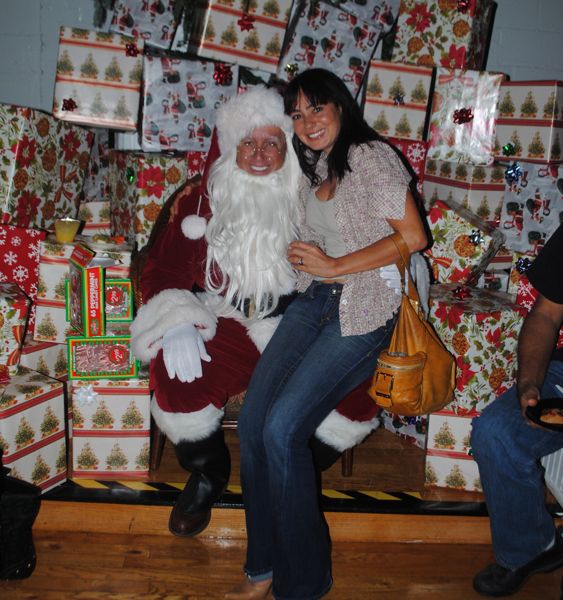 Santa with Juliana Pinto of Avenue Smooth Skin. 