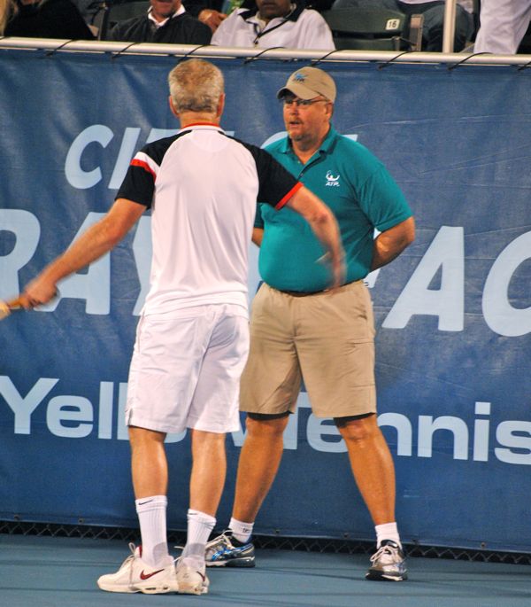 John McEnroe enraged by a call, gets in the face of a linesman. Later, he would smash his racket over the net after missing a shot. 