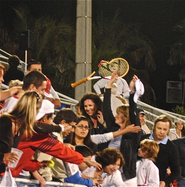 After the match, McEnroe gave his smashed racket to a fan. 