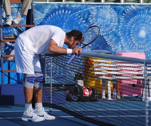 Mark Philippoussis rewards the net for a kind bounce during his match with Mikael Pernfors. 