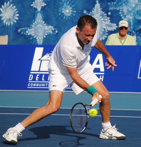 Mikael Pernfors digs for this shot against Mark Philippoussis.