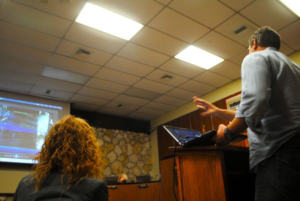 Blue Web Mobile Media CEO Daniel Kinney presents the virtual kiosk system to Delray Beach city commissioners. Tuesday evening. Downtown Marketing Cooperative Executive Director Sarah Martin looks on. 