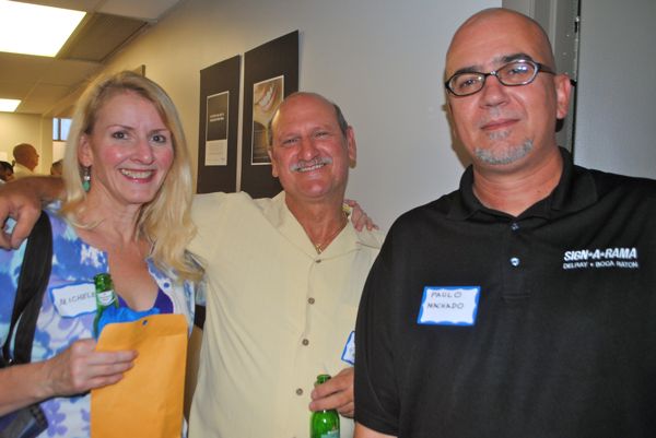 Michele Vink, representing the Earnhart Law Firm, with Steve Carlino of Pixel Print in Delray Beach and Paulo Machado of Sign A Rama in Delray Beach. 