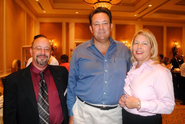 Michael E. Chapnick of Chapnick Community Association Law, left, with Raymond J. Filorimo of Guidance Wealth Management and Diana Byrne of Diana Byrne PA real estate. 