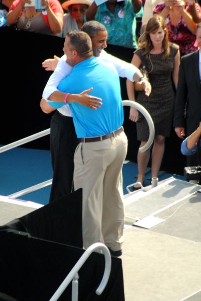 Fort Pierce Pizza shop owner Scott Van Duzer greets Obama as he walks onto the stage