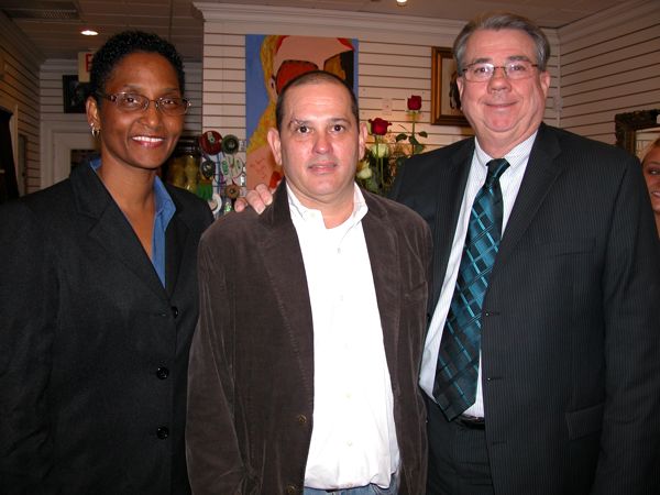 Delray City Commissioner Angelita Gray, with shop owner Sean Sheppard and Delray Mayor Woodie McDuffie. 