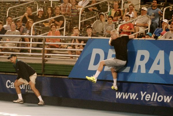 John McEnroe climbing the back wall Saturday night. 