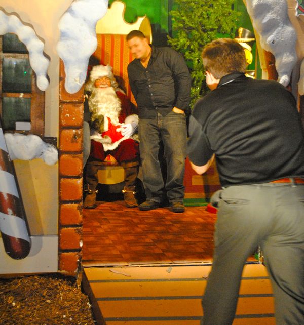 A four-legged kid presents his wish list (bones, biscuits and few chew toys, we think) to Santa Claus